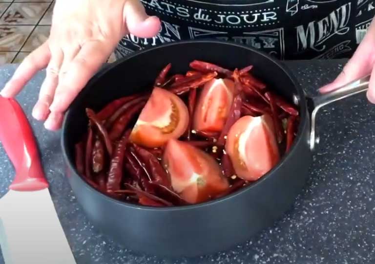 Put The Tomatoes And Red Chili Into The Pan