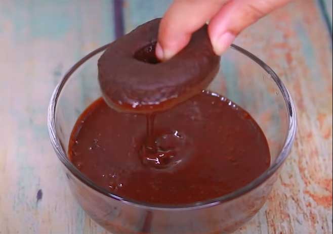 Dip both Sides Of The Donut Into The Chocolate