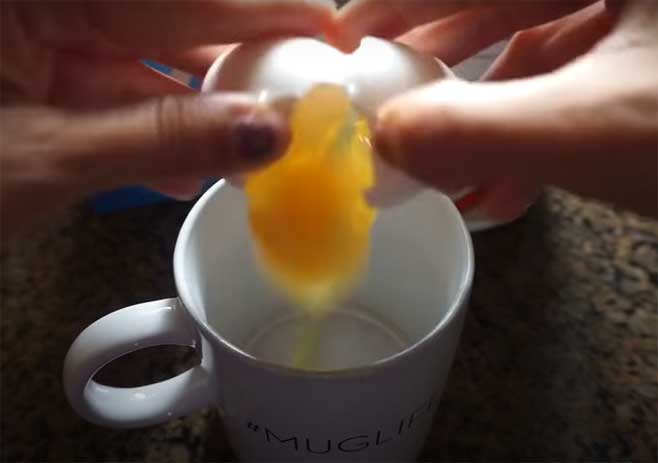 Add The Egg Into The Mug And Mix