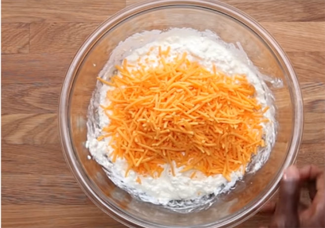 Add shredded cheddar