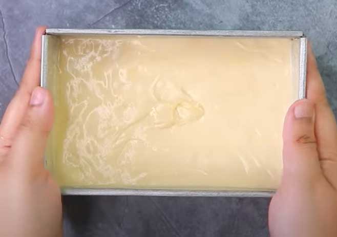 Pour the batter into a greased mold