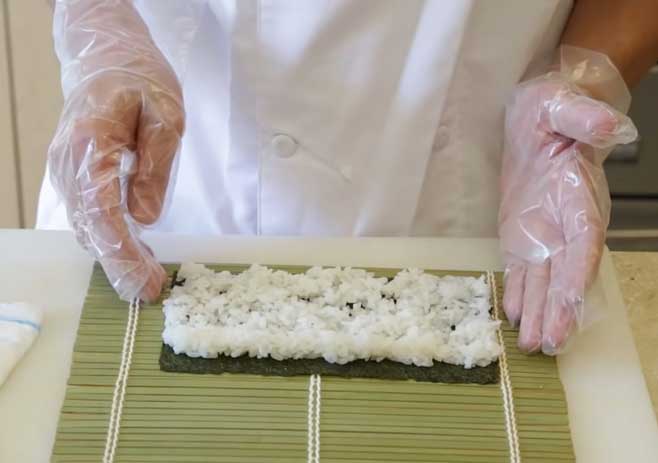 Spread Sushi Rice on Bamboo Mat