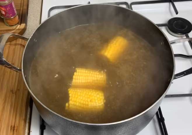 Boil the corn and potato