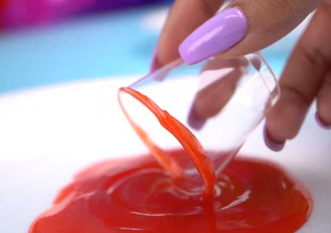Dip the border of the shot-glass in Chamoy
