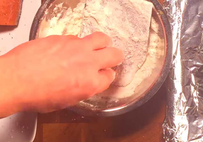  Dredge the fish in flour