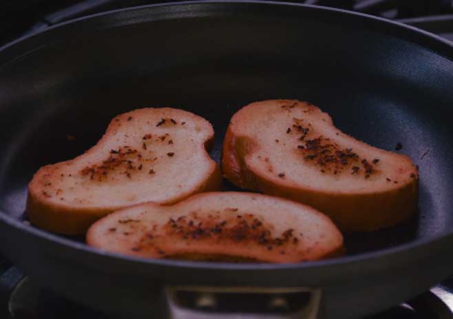 Place the bread into the pan