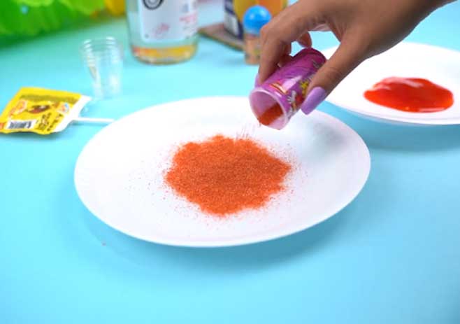 Spread out dry powders and chamoy on the plates