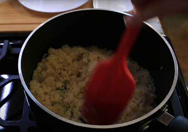 Stir the rice with butter