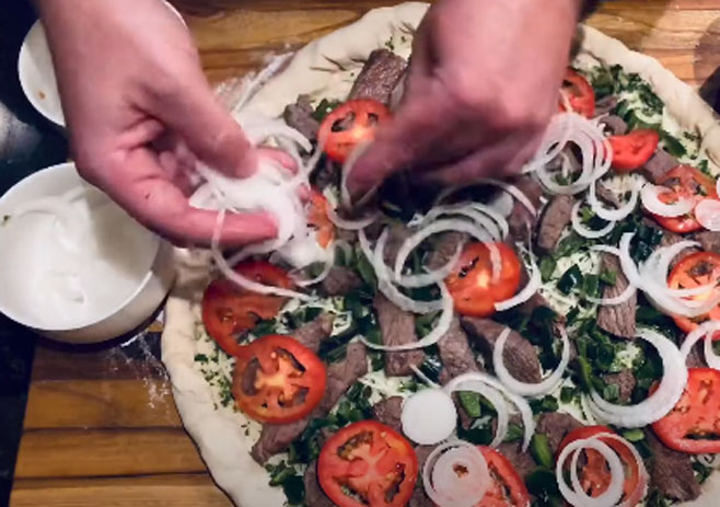 Add Beef, tomato slices, and onion rings