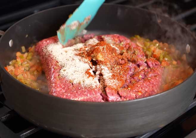 Add the spices and cooked white rice