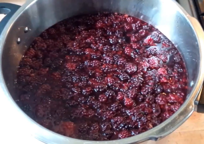 Melt sugar and simmer the berries
