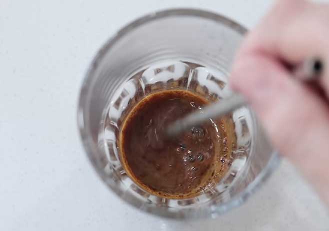 Mix the coffee powder with water