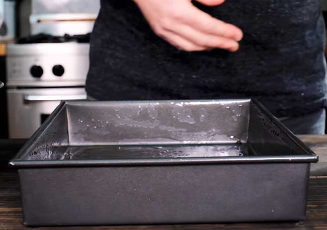 Prepare the baking dish and preheat the oven