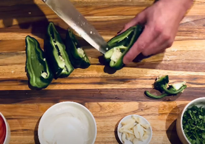 Slice in half poblano peppers and tomatoes