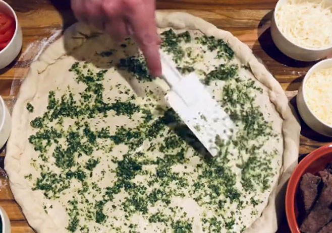 Spread Cilantro pesto over the crust