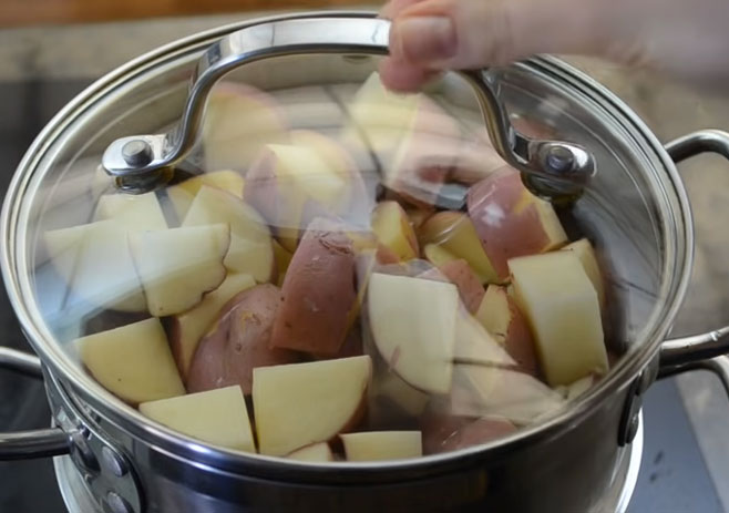 Boil the cut potatoes with salt