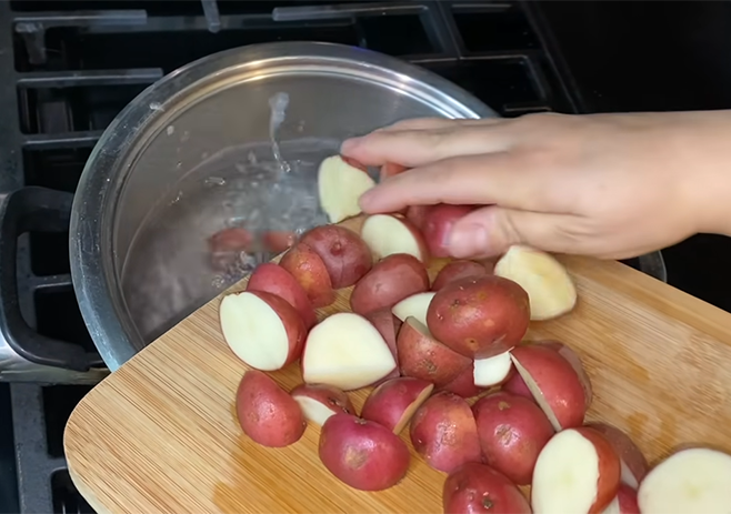 Cut the potatoes and boil