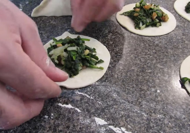 Place the filling on the round shape dough