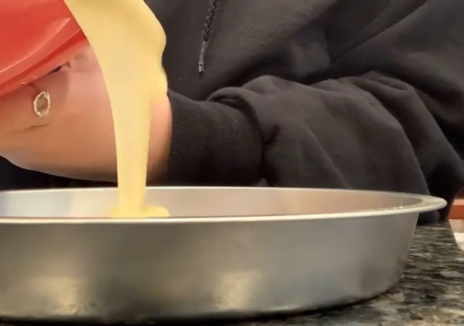 Pour cake batter into pan