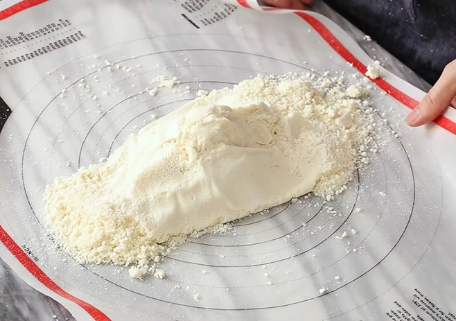 Transfer the dough mixer to a plastic mat