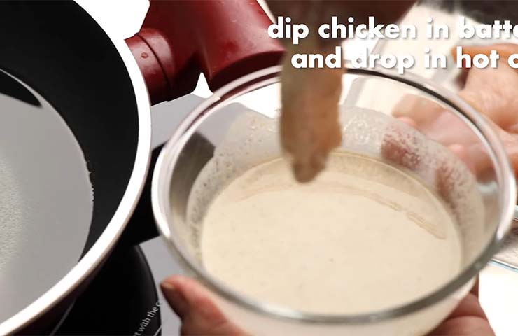 Dip the chicken into batter and fry