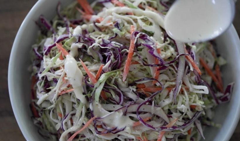 Pouring the dressing into the bowl