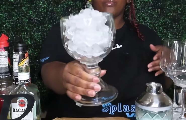 Fill the glass and shaker with ice cubes